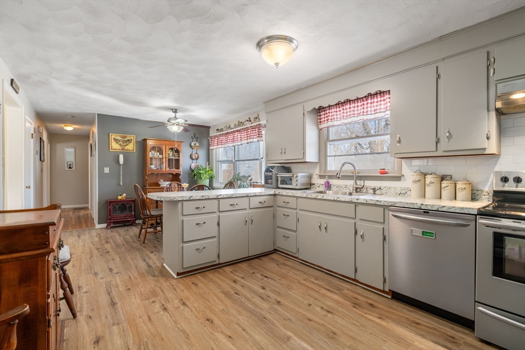 82 Glenwood Road Rutland, MA 01543 - Photo 5 of 30 a kitchen with sink cabinets and wooden floor