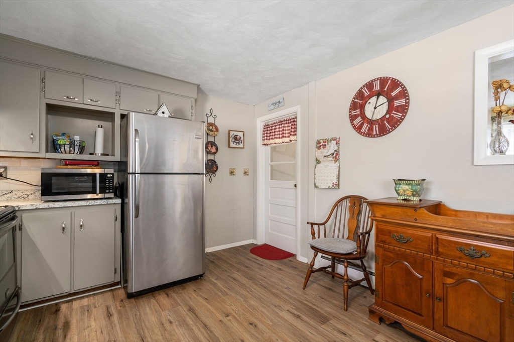82 Glenwood Road Rutland, MA 01543 - Photo 8 of 30 a kitchen with stainless steel appliances a refrigerator and a stove top oven