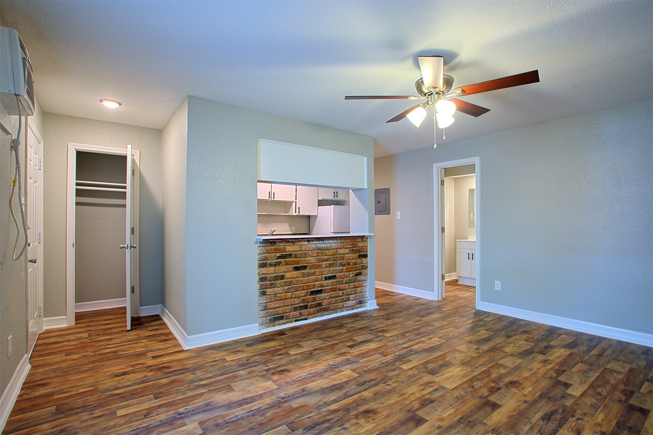 1419 Hawthorne Street, Unit 22 Houston, TX 77006 - Photo 2 of 27 wooden floor in an empty room with a window