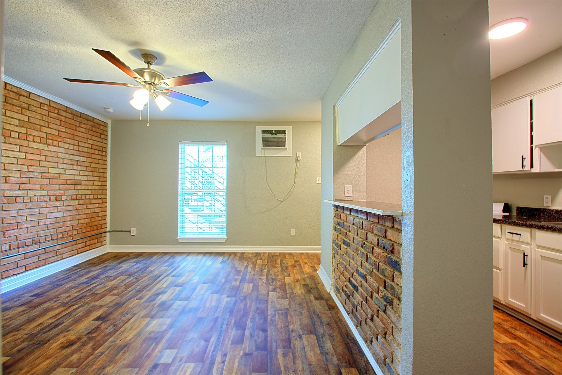 1419 Hawthorne Street, Unit 22 Houston, TX 77006 - Photo 7 of 27 a view of livingroom with hardwood floor and a ceiling fan