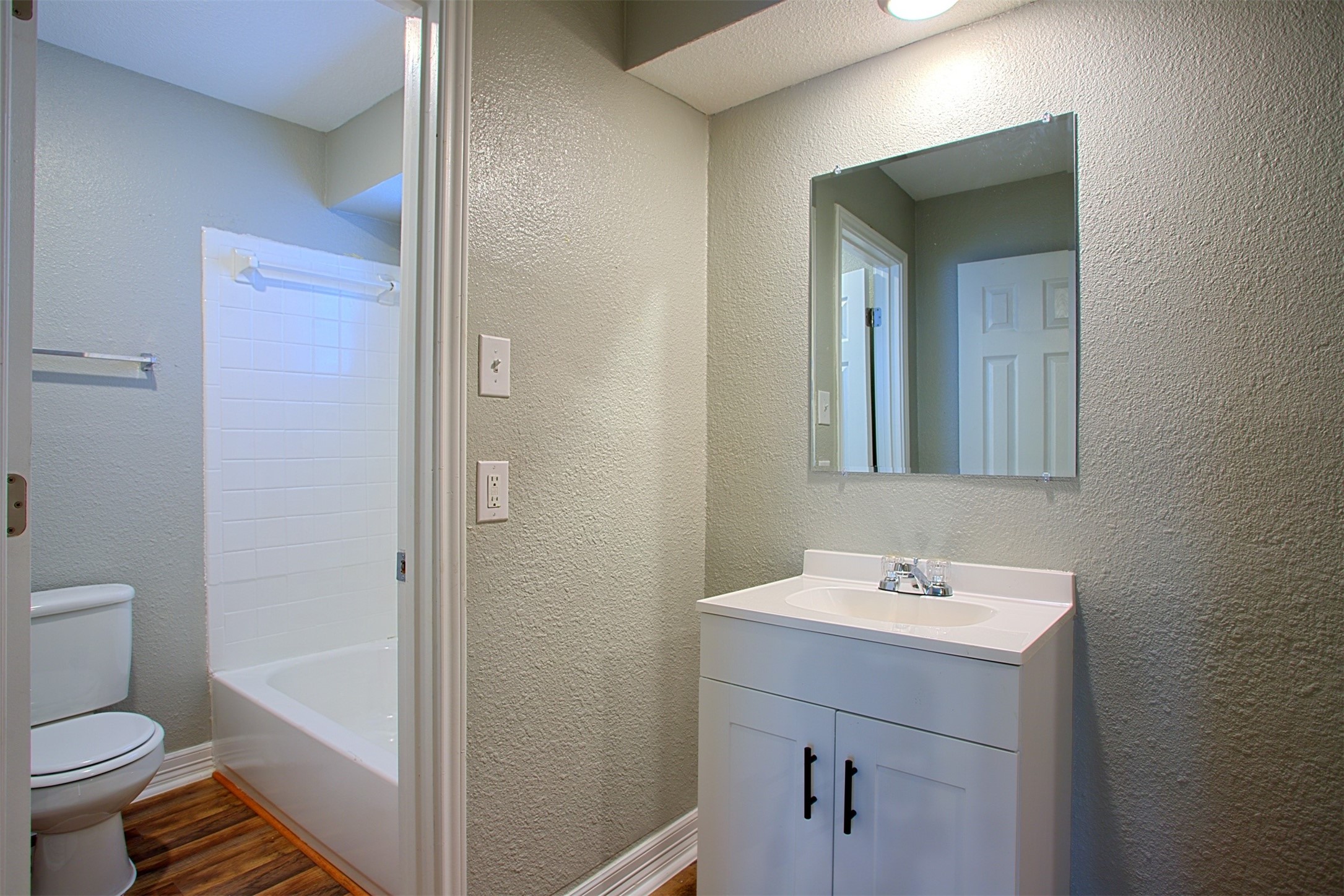 1419 Hawthorne Street, Unit 22 Houston, TX 77006 - Photo 9 of 27 a bathroom with a sink a toilet and shower