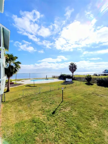 a view of a swimming pool with an outdoor seating
