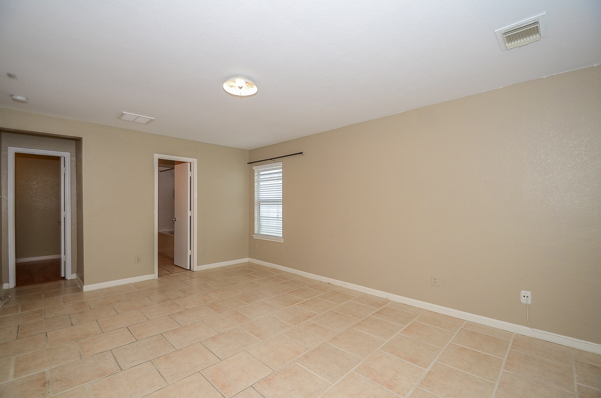 11711 Wainscot Court Houston, TX 77038 - Photo 16 of 32 wooden floor in an empty room