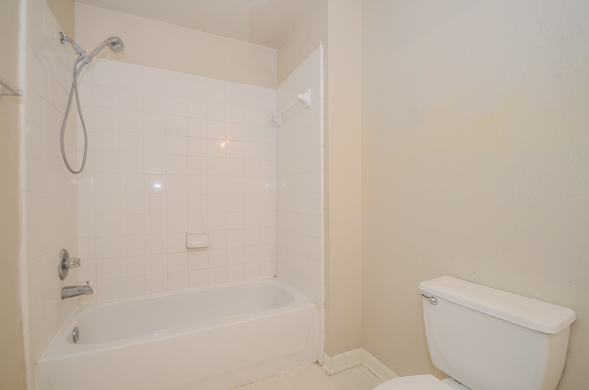 11711 Wainscot Court Houston, TX 77038 - Photo 27 of 32 a bathroom with a bathtub and a shower