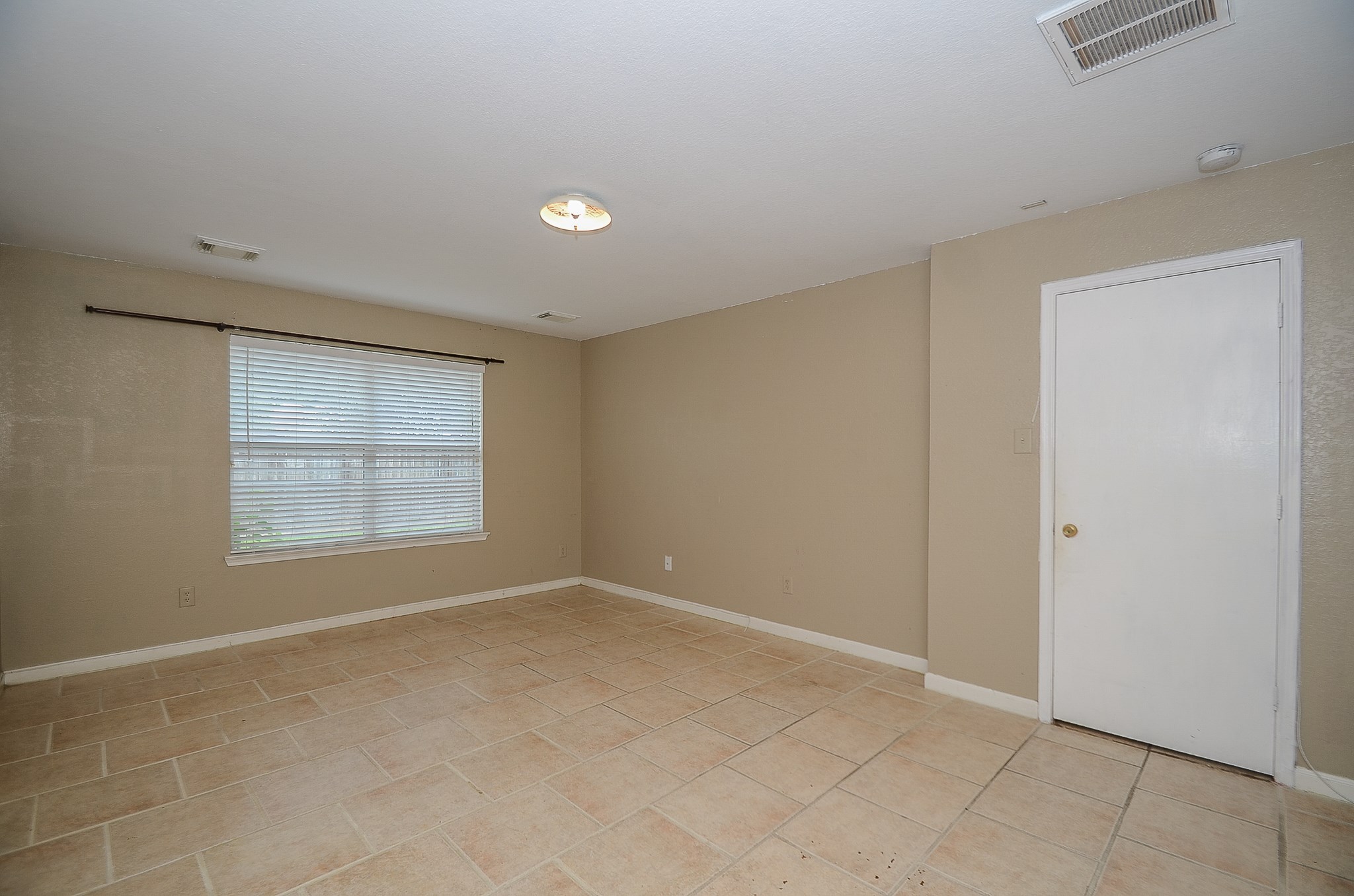 11711 Wainscot Court Houston, TX 77038 - Photo 29 of 32 a view of an empty room with a window