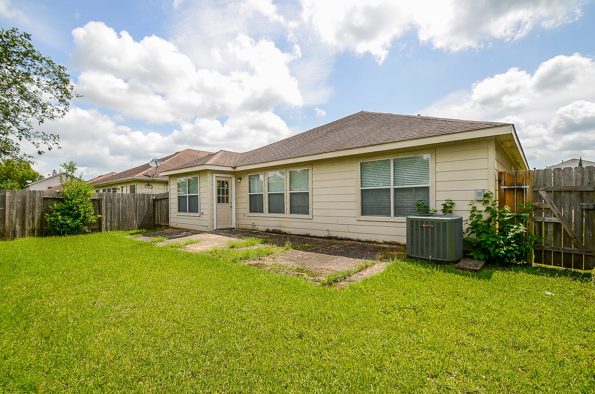11711 Wainscot Court Houston, TX 77038 - Photo 32 of 32 a view of a house with a yard