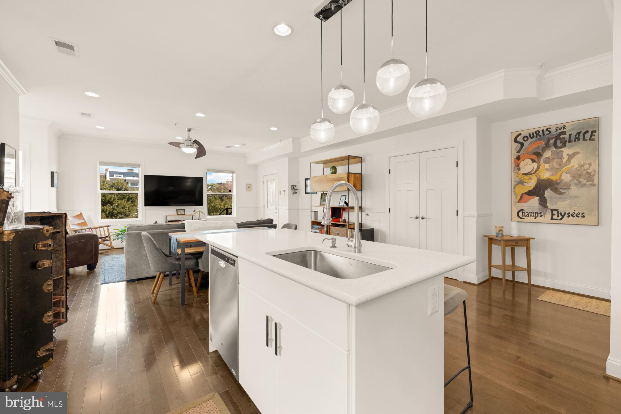 233 S Street Northeast, Unit 4 Washington, DC 20002 - Photo 15 of 37 a living room with furniture a flat screen tv and kitchen view