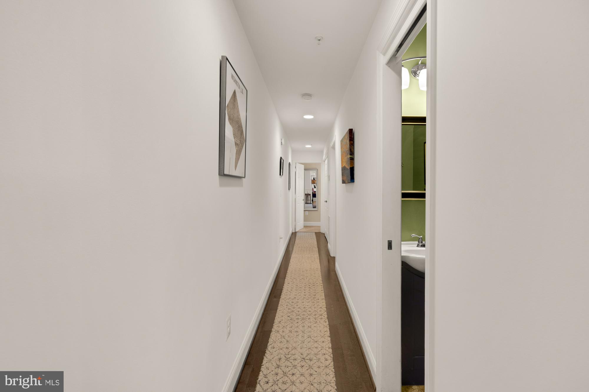 233 S Street Northeast, Unit 4 Washington, DC 20002 - Photo 18 of 37 a view of a hallway with wooden floor and staircase