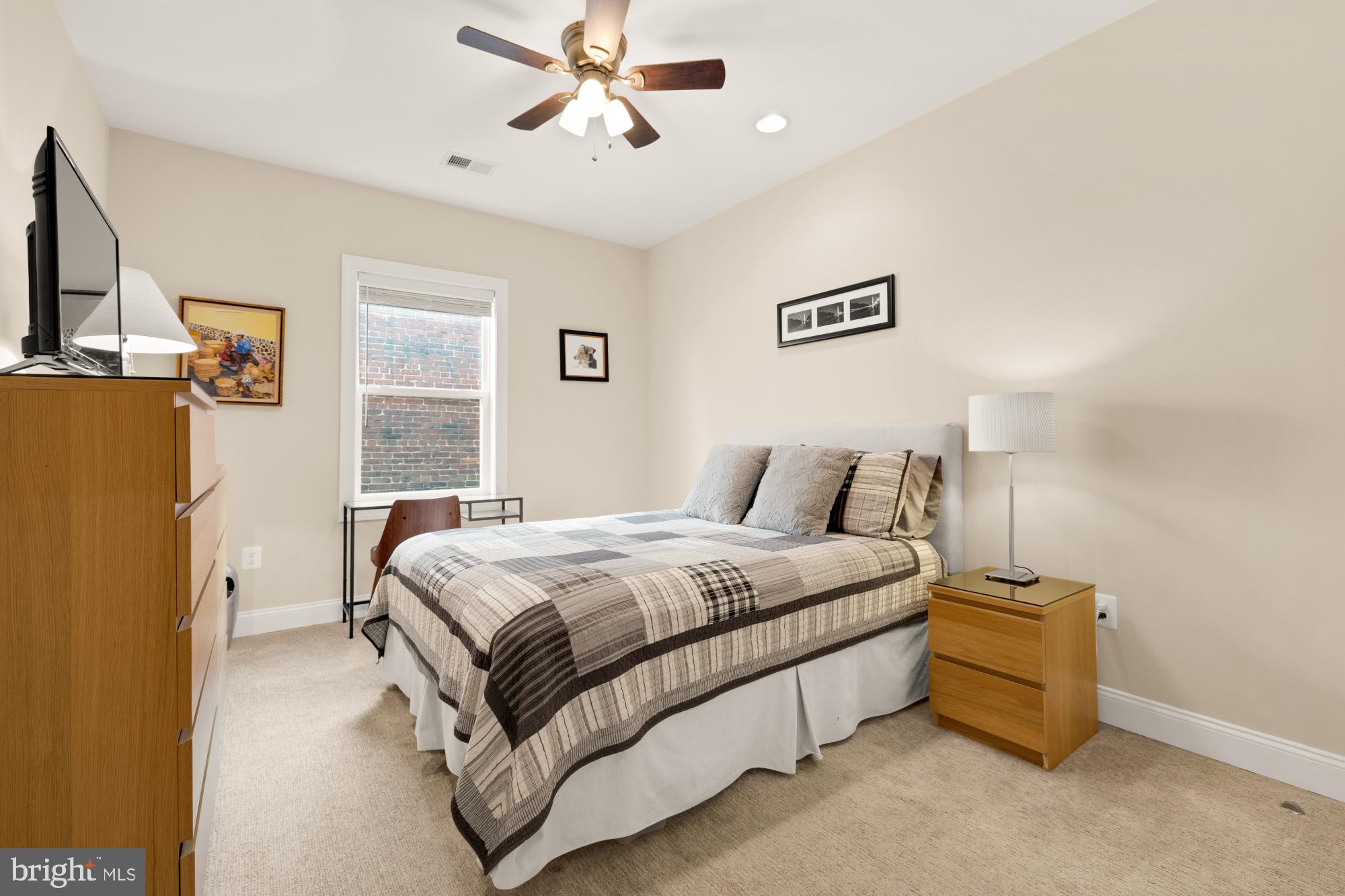233 S Street Northeast, Unit 4 Washington, DC 20002 - Photo 20 of 37 a spacious bedroom with a bed and a chandelier