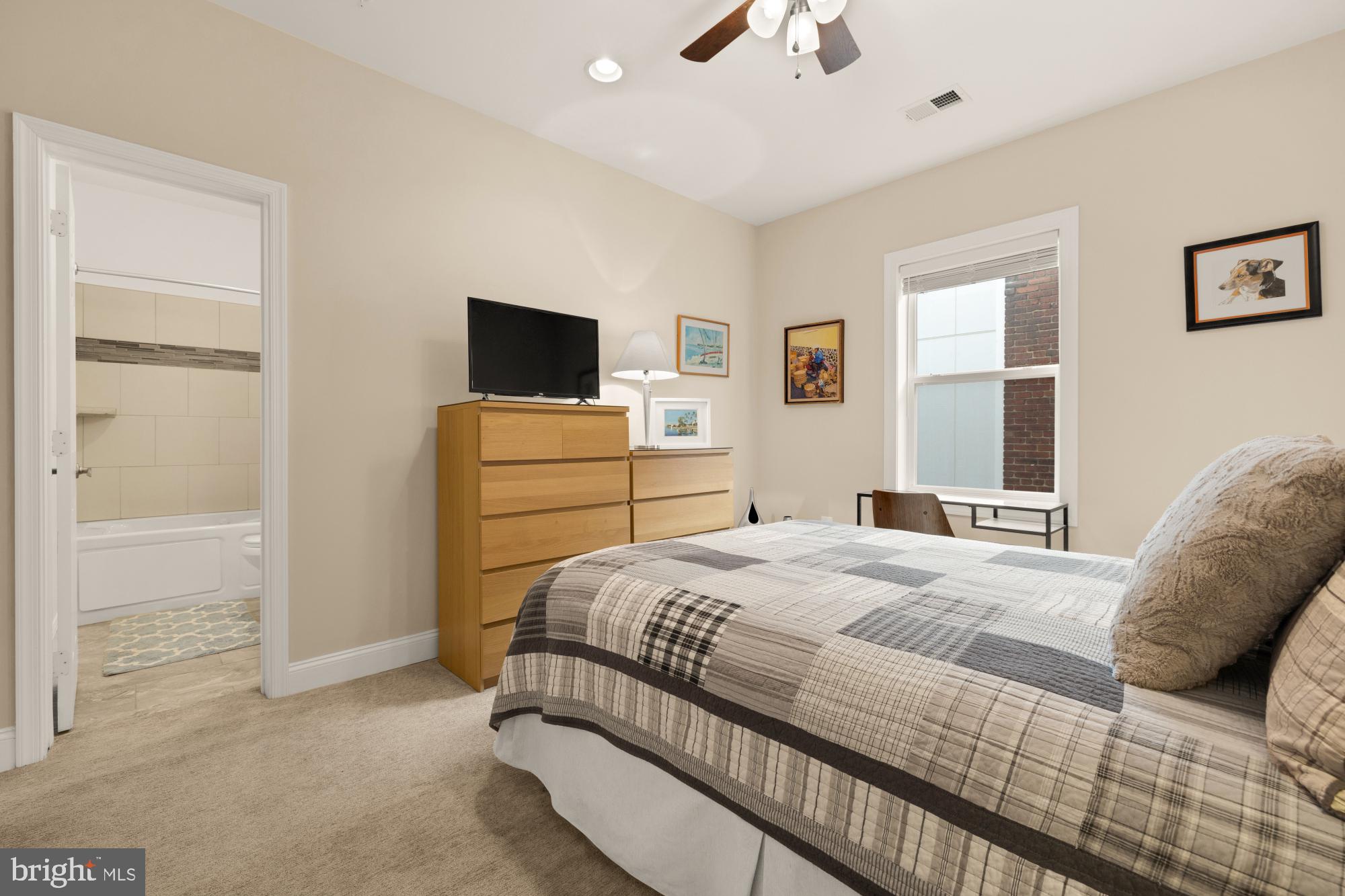 233 S Street Northeast, Unit 4 Washington, DC 20002 - Photo 21 of 37 a bedroom with a bed and a flat screen tv