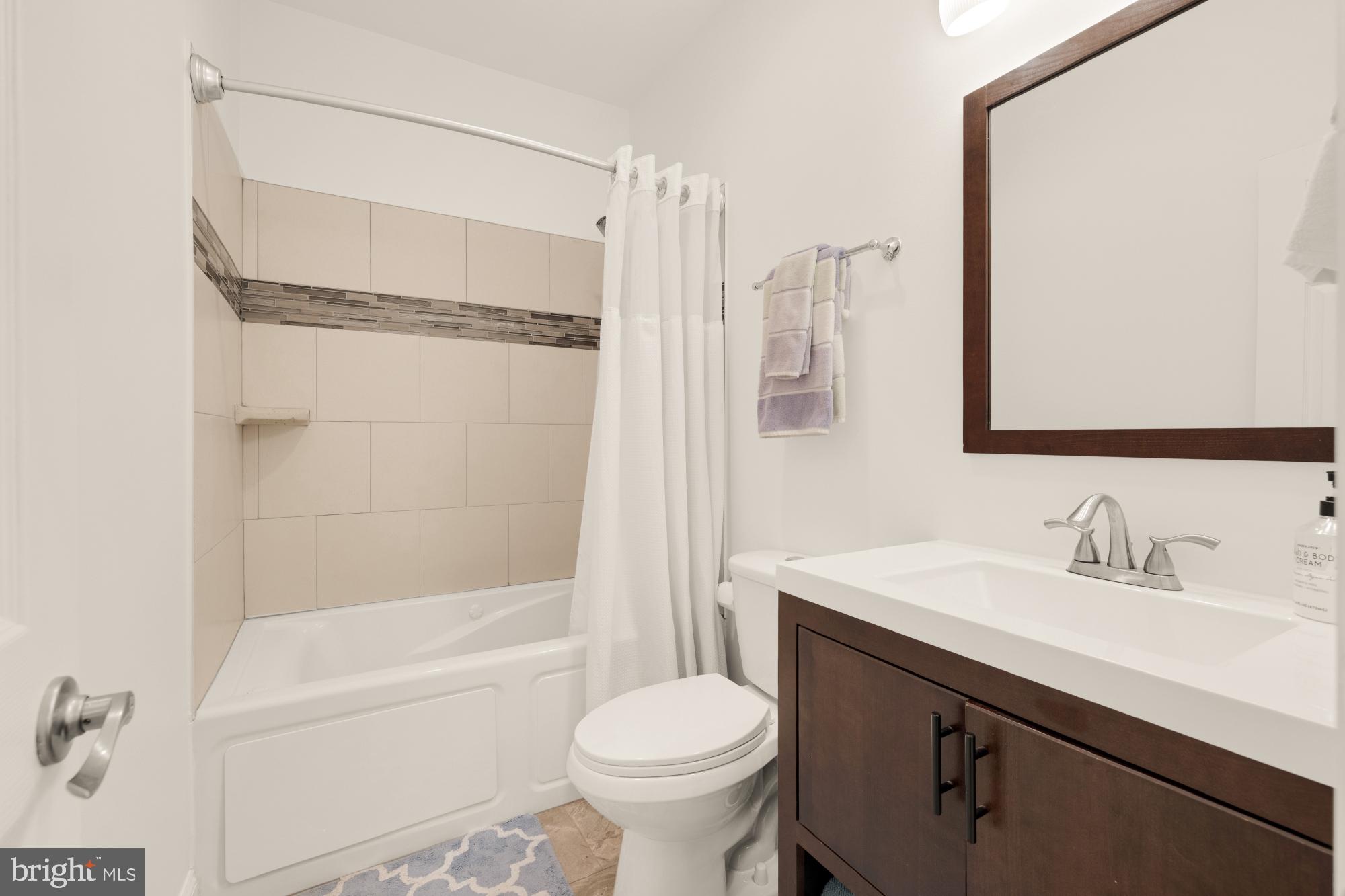 233 S Street Northeast, Unit 4 Washington, DC 20002 - Photo 22 of 37 a bathroom with a sink toilet and shower