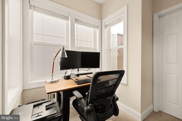 a view of a workspace with furniture