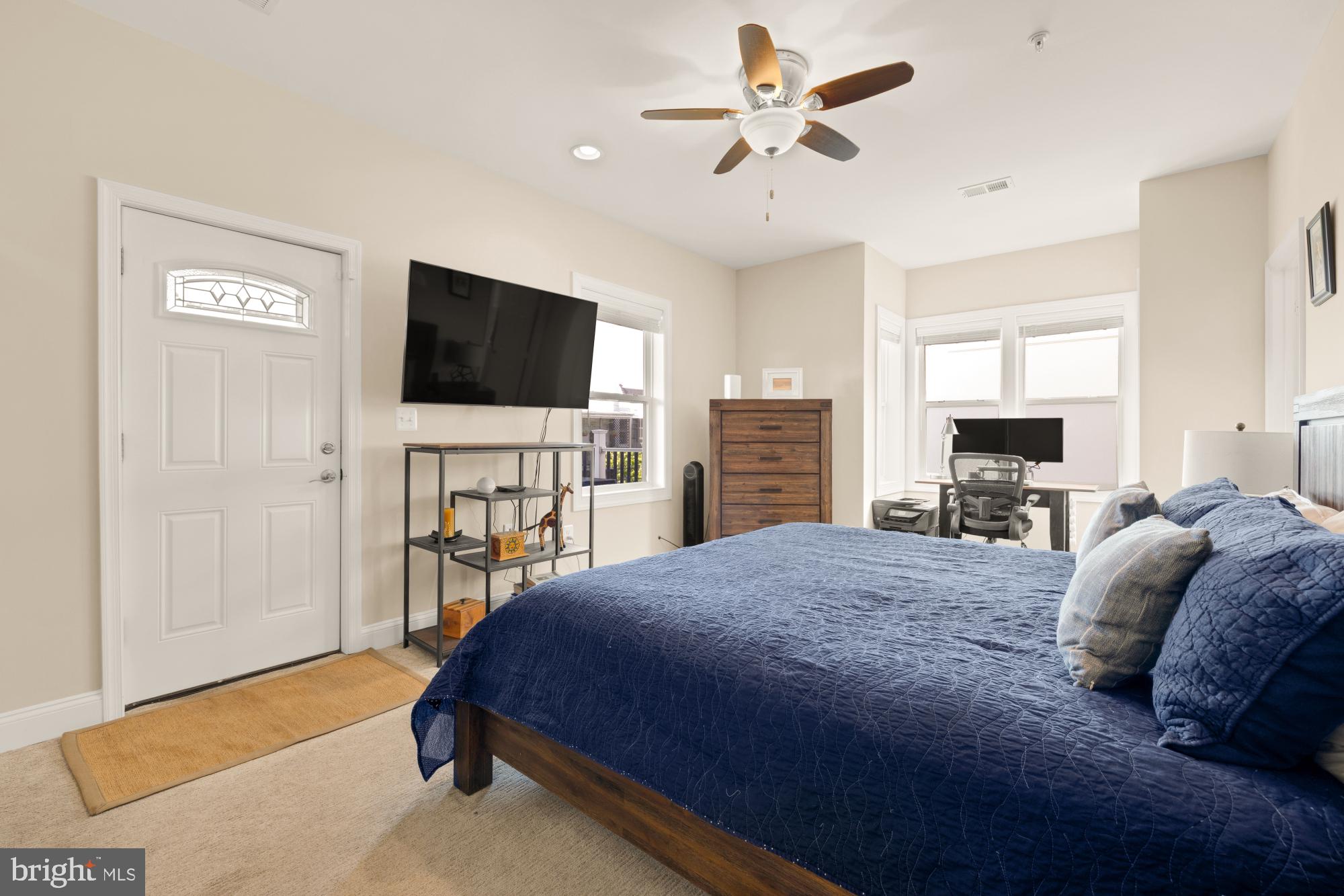 233 S Street Northeast, Unit 4 Washington, DC 20002 - Photo 30 of 37 a spacious bedroom with a bed and a flat screen tv