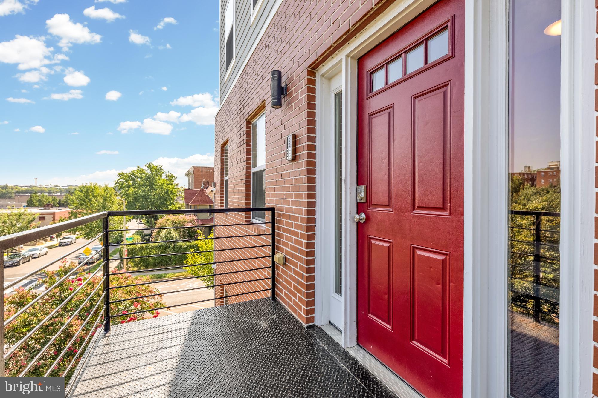 233 S Street Northeast, Unit 4 Washington, DC 20002 - Photo 3 of 37 a view of balcony with wooden floor and fence