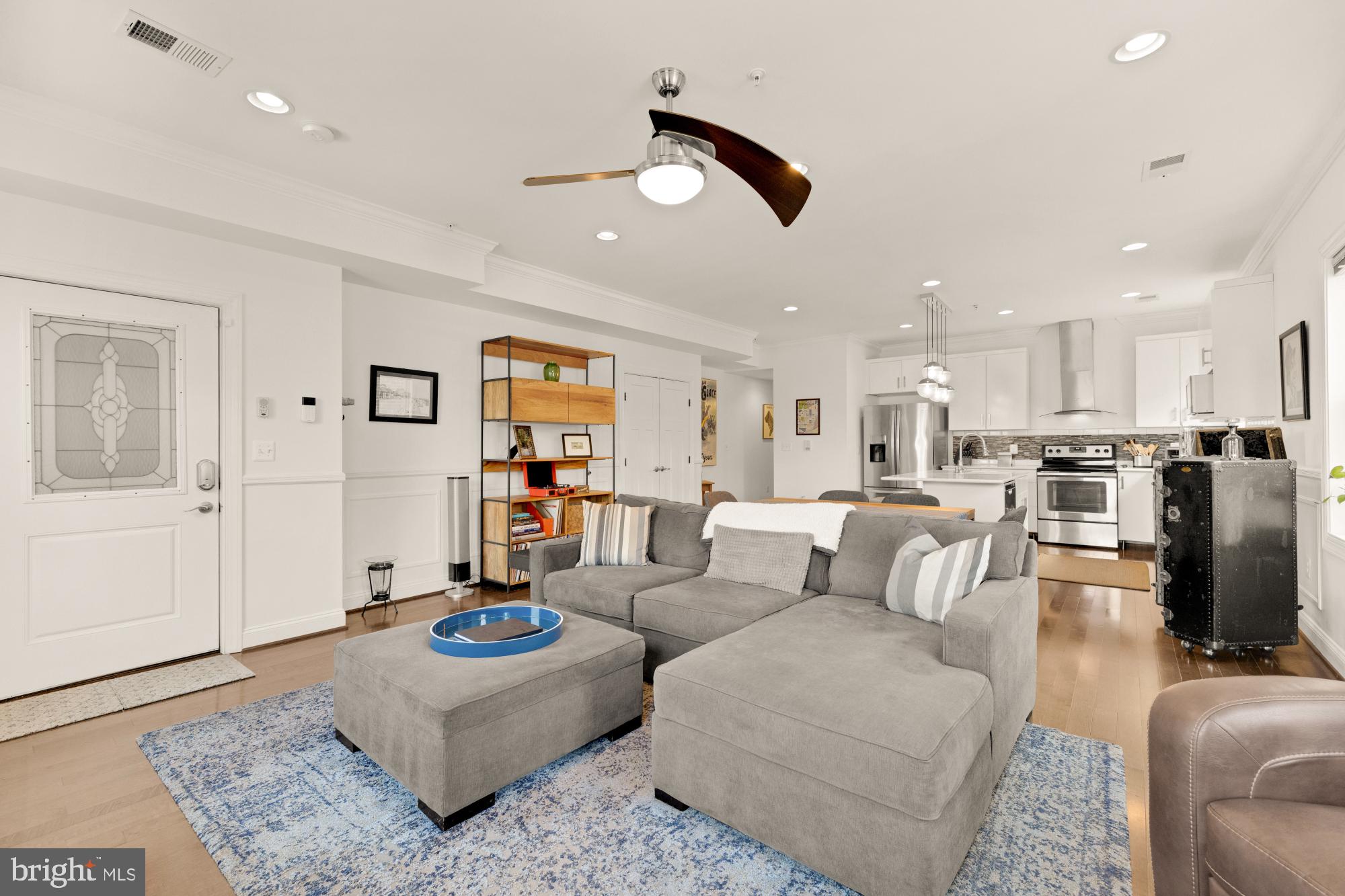 233 S Street Northeast, Unit 4 Washington, DC 20002 - Photo 5 of 37 a living room with furniture and kitchen view