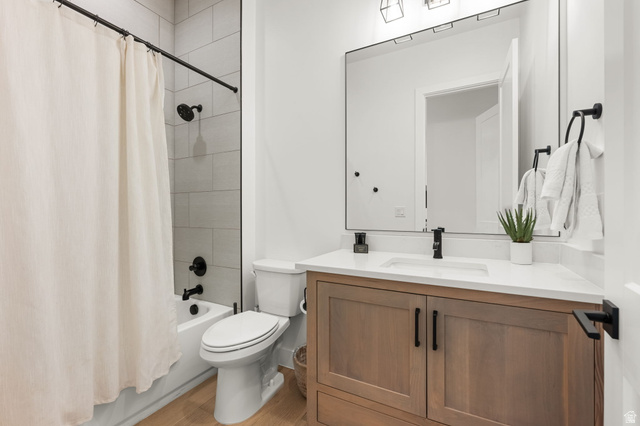 5354 Cyan Lane St. George, UT 84790 - Photo 32 of 45 Bathroom featuring vanity, shower / bath combo, and light wood finished floors