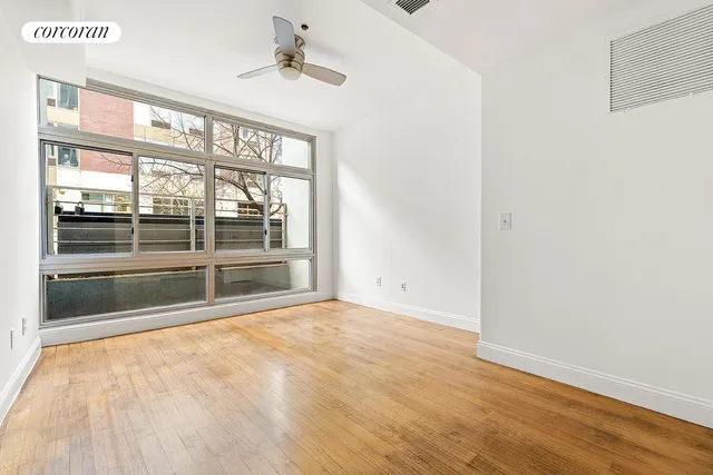 a view of an empty room with a window