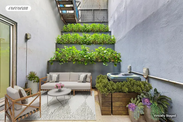 a outdoor living space with furniture and plants