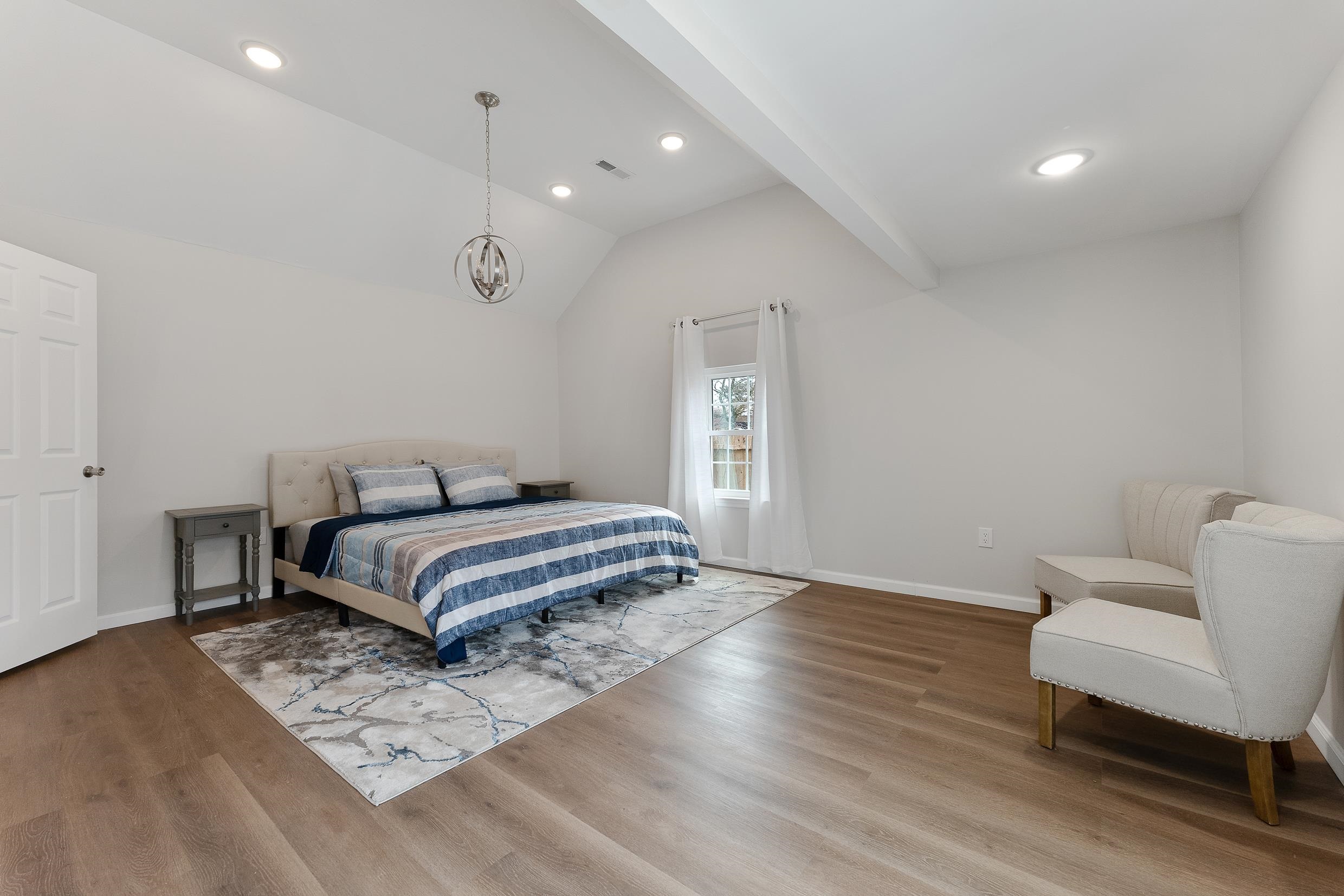545 Seashore Road Erma, NJ 08204 - Photo 15 of 22 a bedroom with a bed and a chair