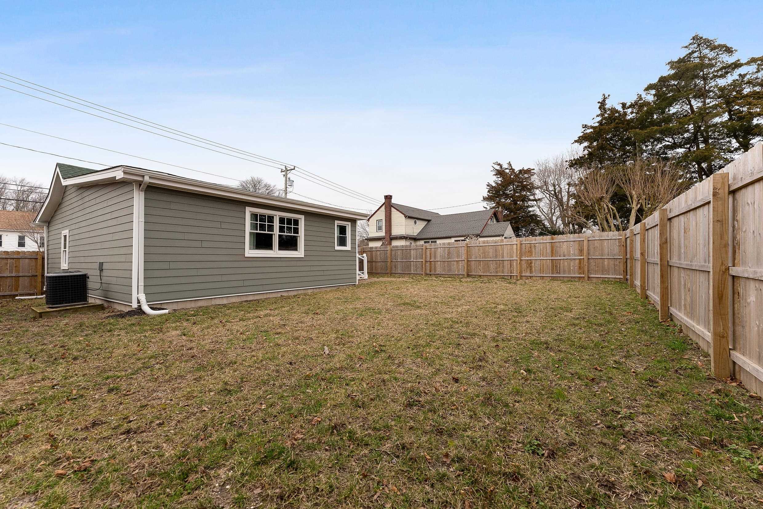 545 Seashore Road Erma, NJ 08204 - Photo 4 of 22 a view of backyard with wooden fence