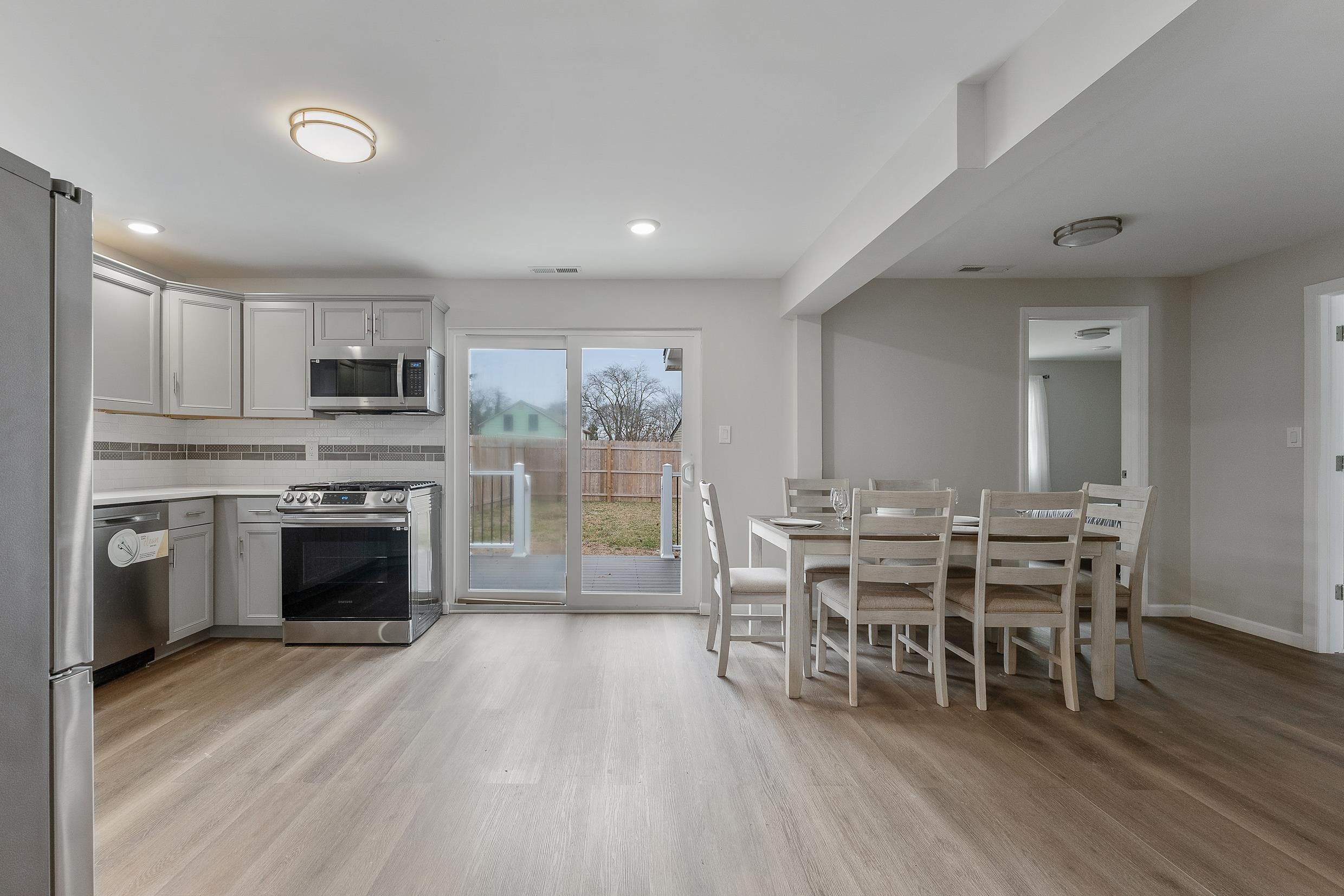 545 Seashore Road Erma, NJ 08204 - Photo 10 of 22 a view of a kitchen with kitchen island wooden floor wooden floor and stainless steel appliances