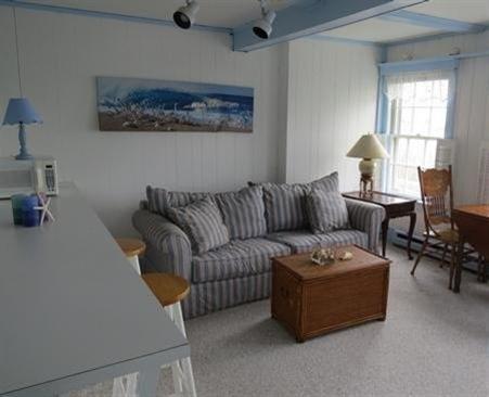 73 Main Street, Unit 6 Chatham, MA 02633 - Photo 4 of 8 a living room with furniture and a window