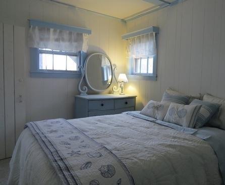 73 Main Street, Unit 6 Chatham, MA 02633 - Photo 6 of 8 a bedroom with a bed and a window