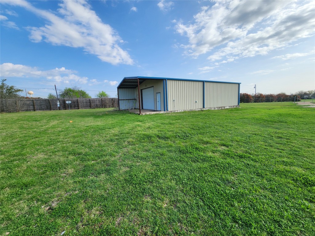 1742 Rowe Loop Pflugerville, TX 78660 - Photo 3 of 13 a view of a house with a big yard and large trees
