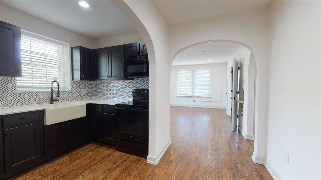 5506 Miller Avenue, Unit 202 Dallas, TX 75206 - Photo 3 of 17 a kitchen with a sink and wooden floor