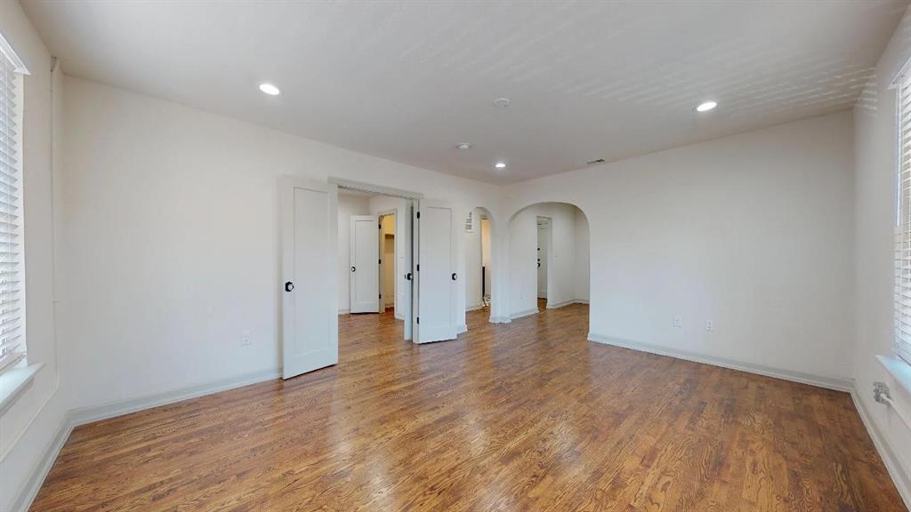 5506 Miller Avenue, Unit 202 Dallas, TX 75206 - Photo 6 of 17 a view of empty room with wooden floor and window