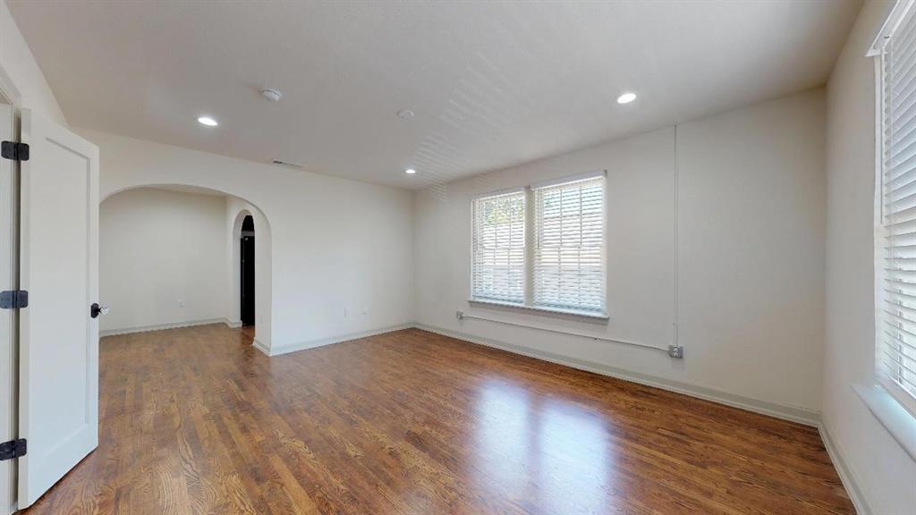 5506 Miller Avenue, Unit 202 Dallas, TX 75206 - Photo 7 of 17 an empty room with wooden floor and windows