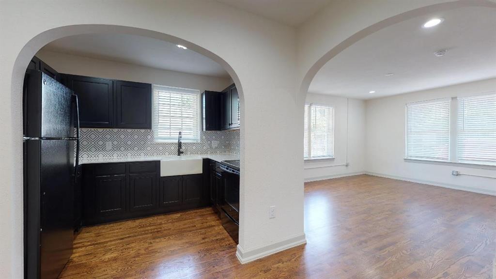5506 Miller Avenue, Unit 202 Dallas, TX 75206 - Photo 10 of 17 a view of kitchen with granite countertop microwave and cabinets