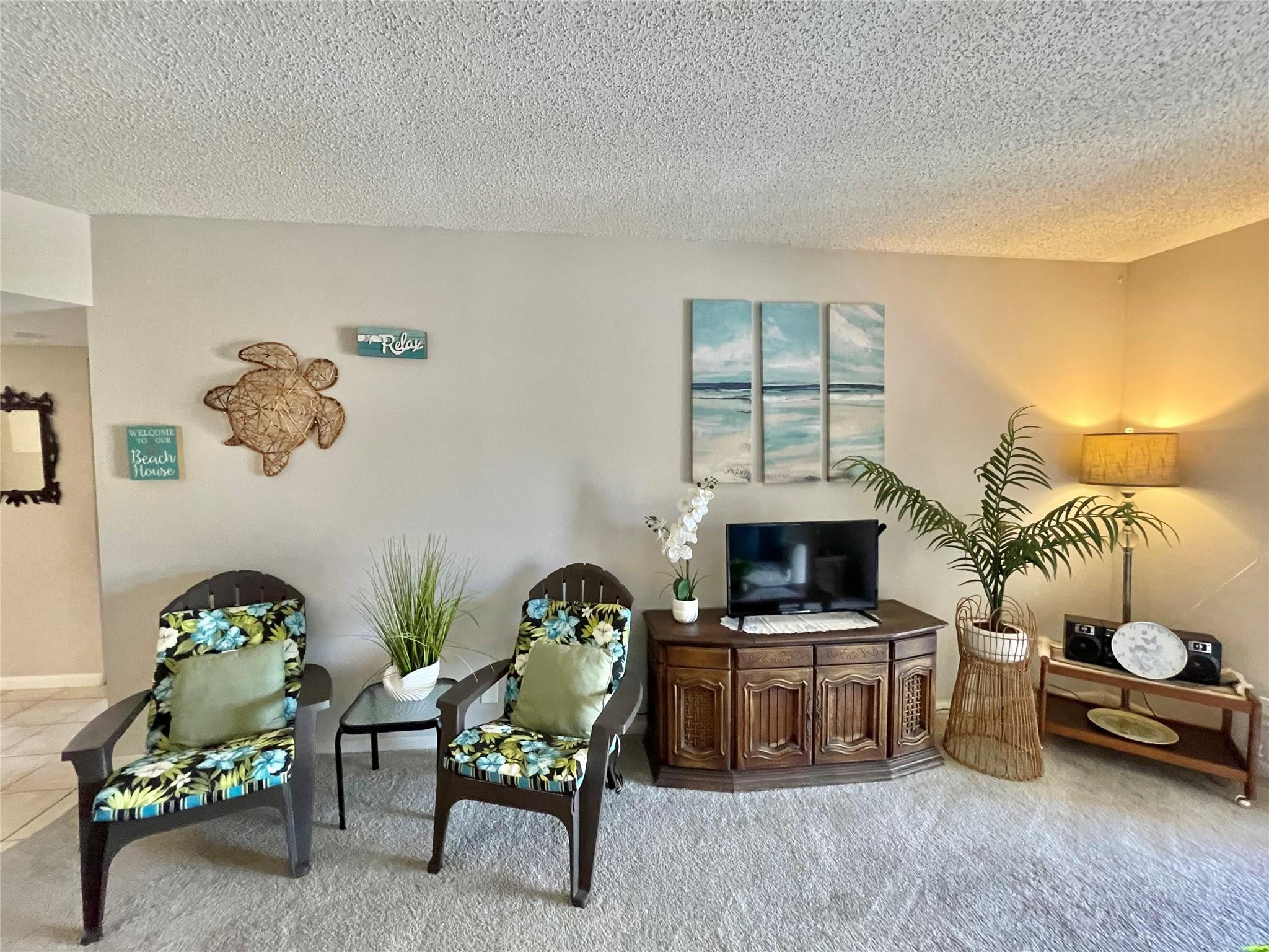 259 South Cypress Road, Unit 536 Pompano Beach, FL 33060 - Photo 14 of 39 a living room with furniture and a fireplace