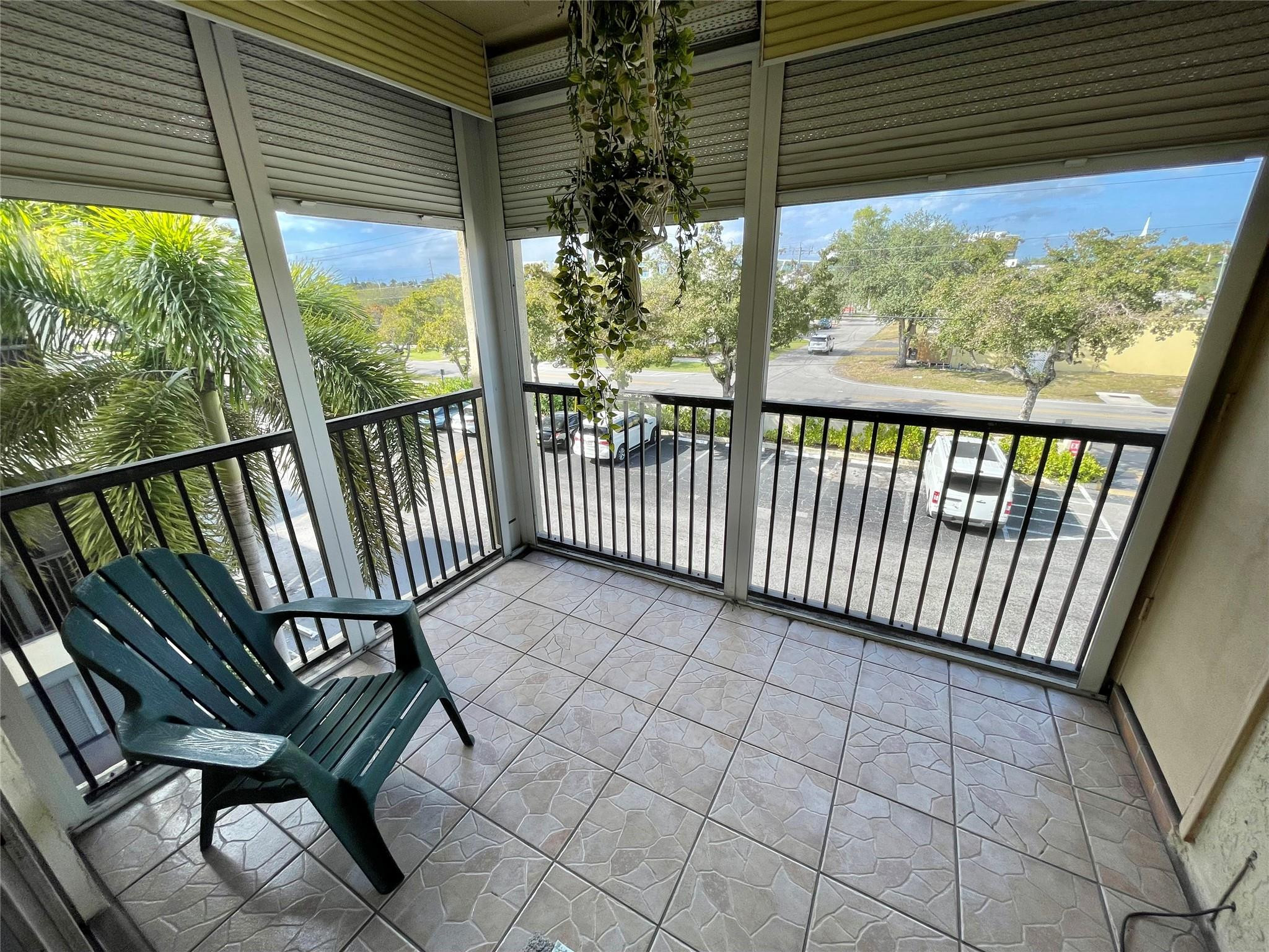 259 South Cypress Road, Unit 536 Pompano Beach, FL 33060 - Photo 17 of 39 a view of a chairs and bench in the balcony