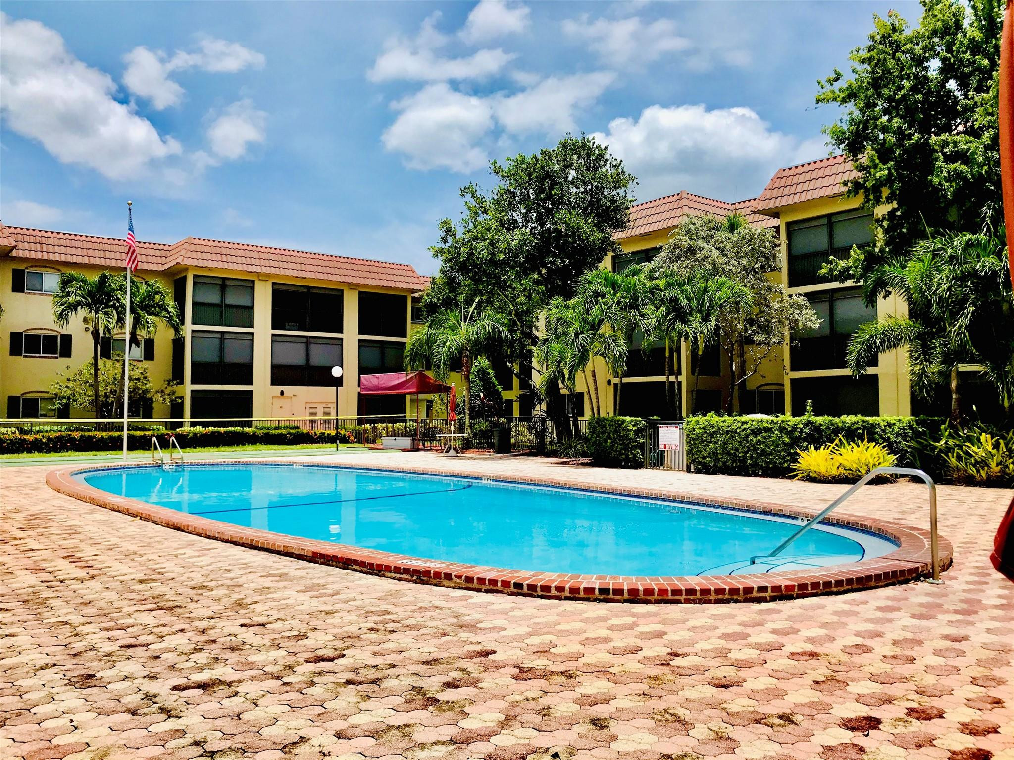 259 South Cypress Road, Unit 536 Pompano Beach, FL 33060 - Photo 20 of 39 a view of a house with swimming pool and porch