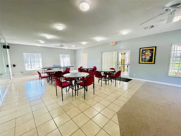 a room with table tennis and air hockey table