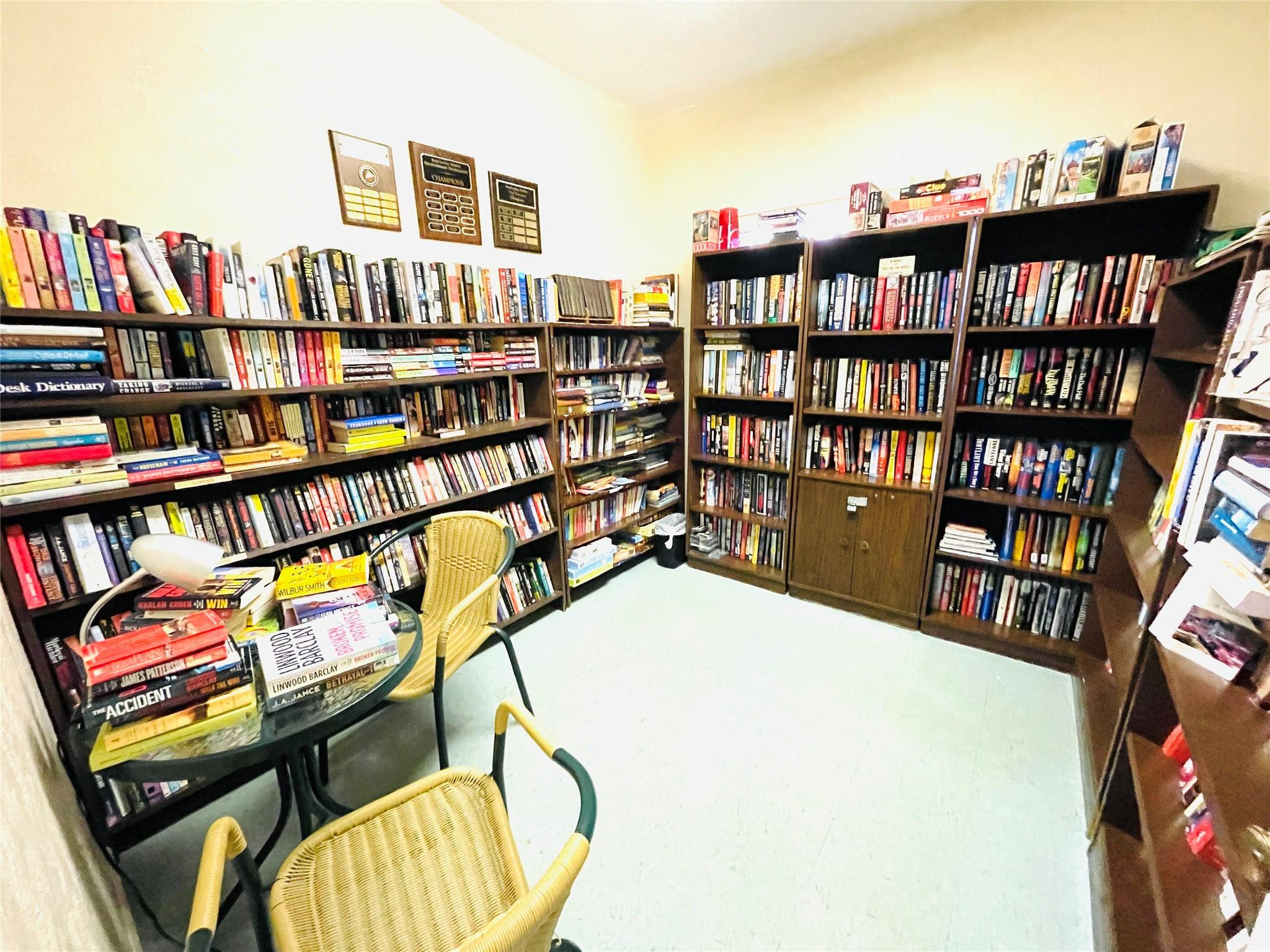 259 South Cypress Road, Unit 536 Pompano Beach, FL 33060 - Photo 31 of 39 a view of a workspace with furniture and book shelf