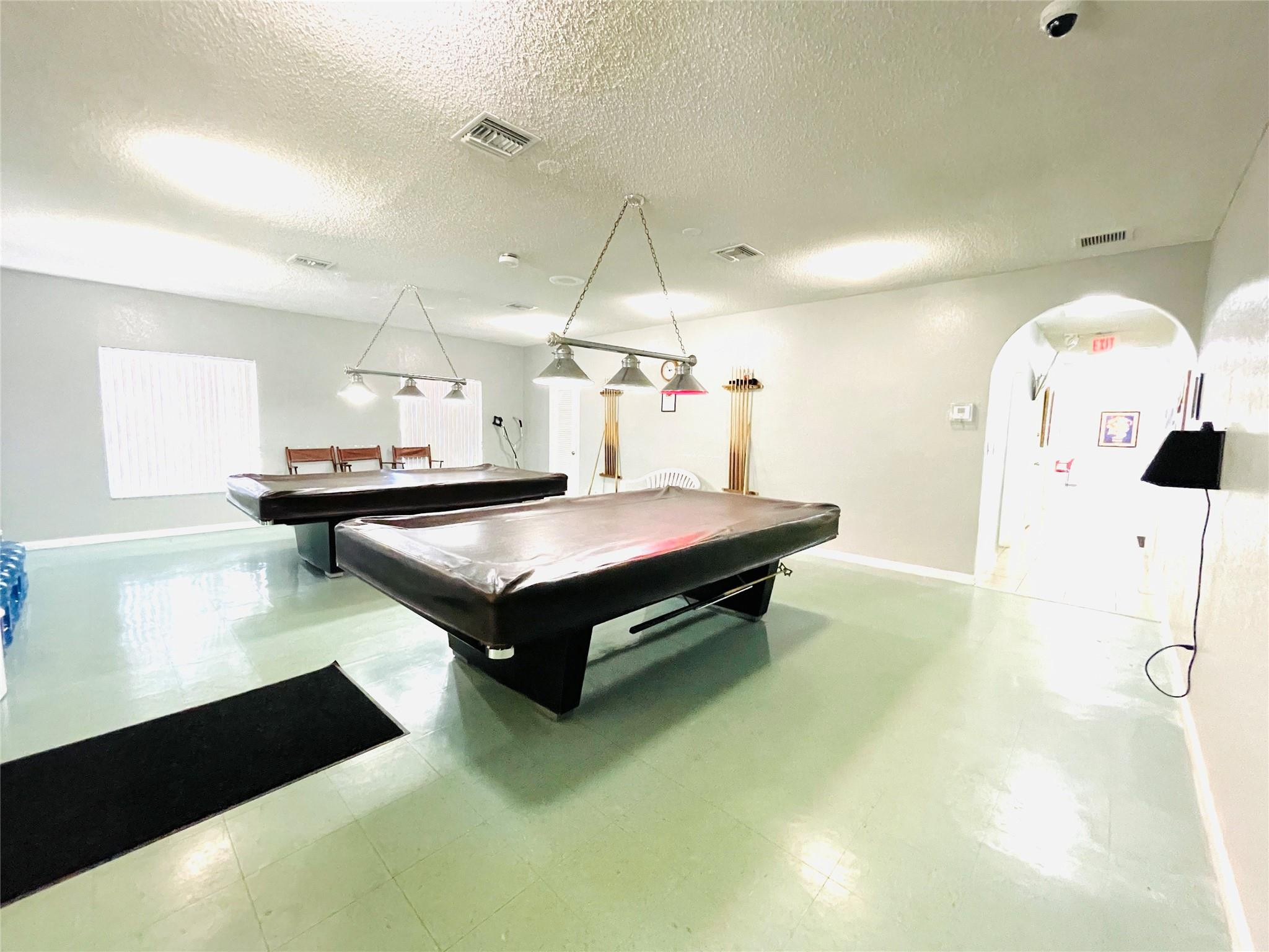 259 South Cypress Road, Unit 536 Pompano Beach, FL 33060 - Photo 32 of 39 a living room with table and chairs
