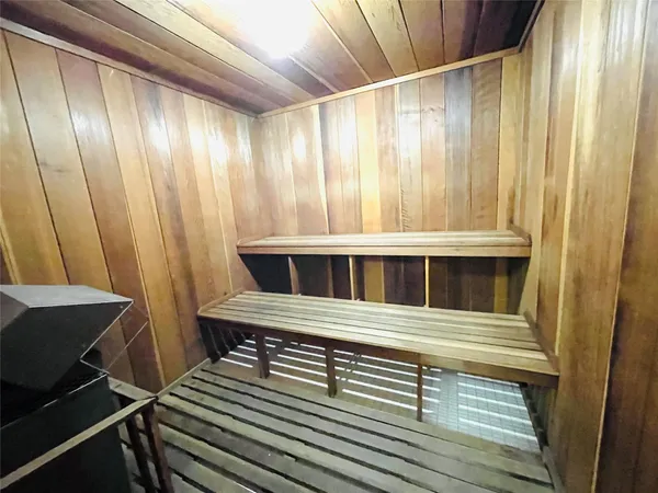a view of a porch with furniture and a yard