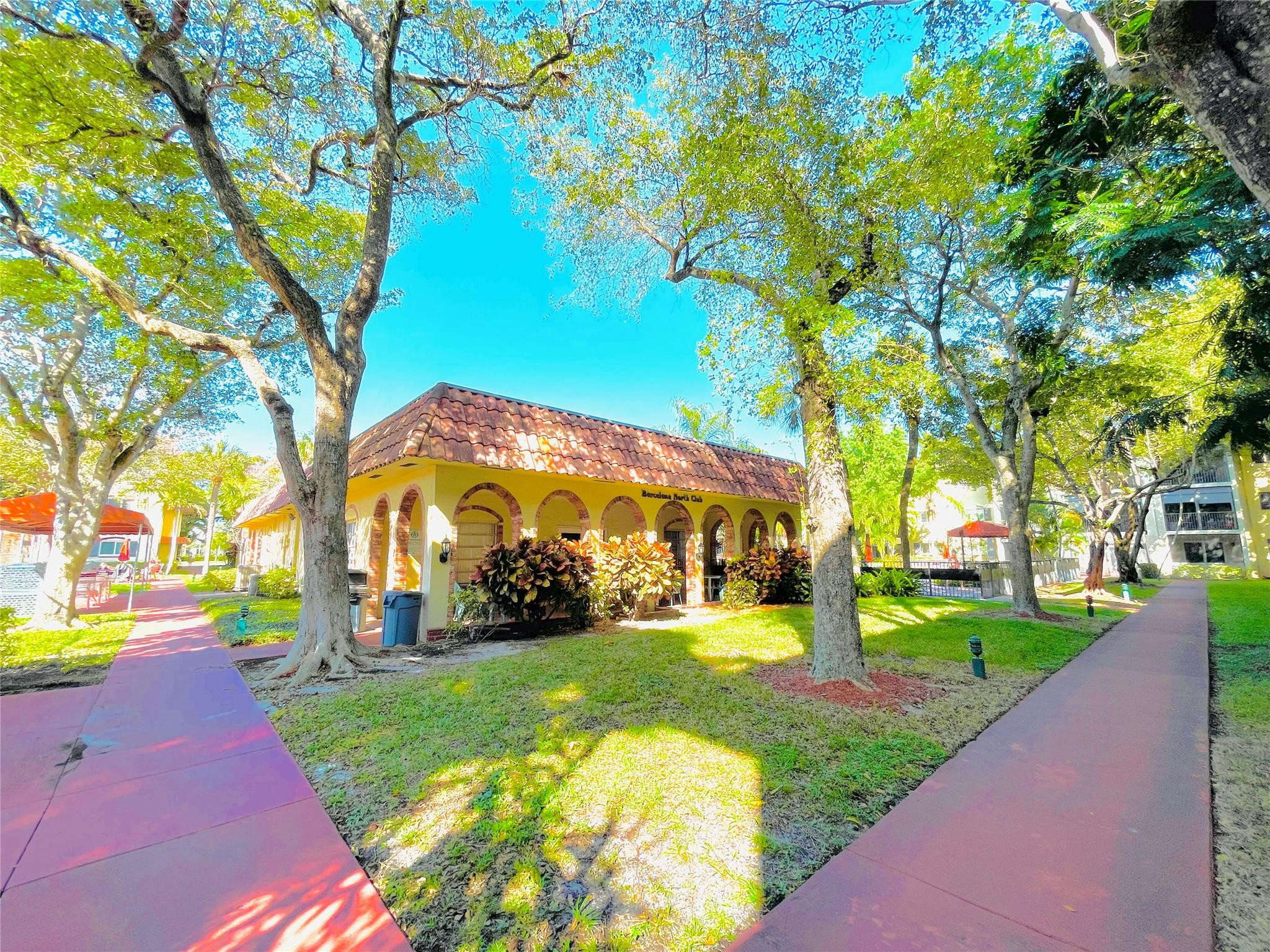 259 South Cypress Road, Unit 536 Pompano Beach, FL 33060 - Photo 38 of 39 a view of a park with large trees