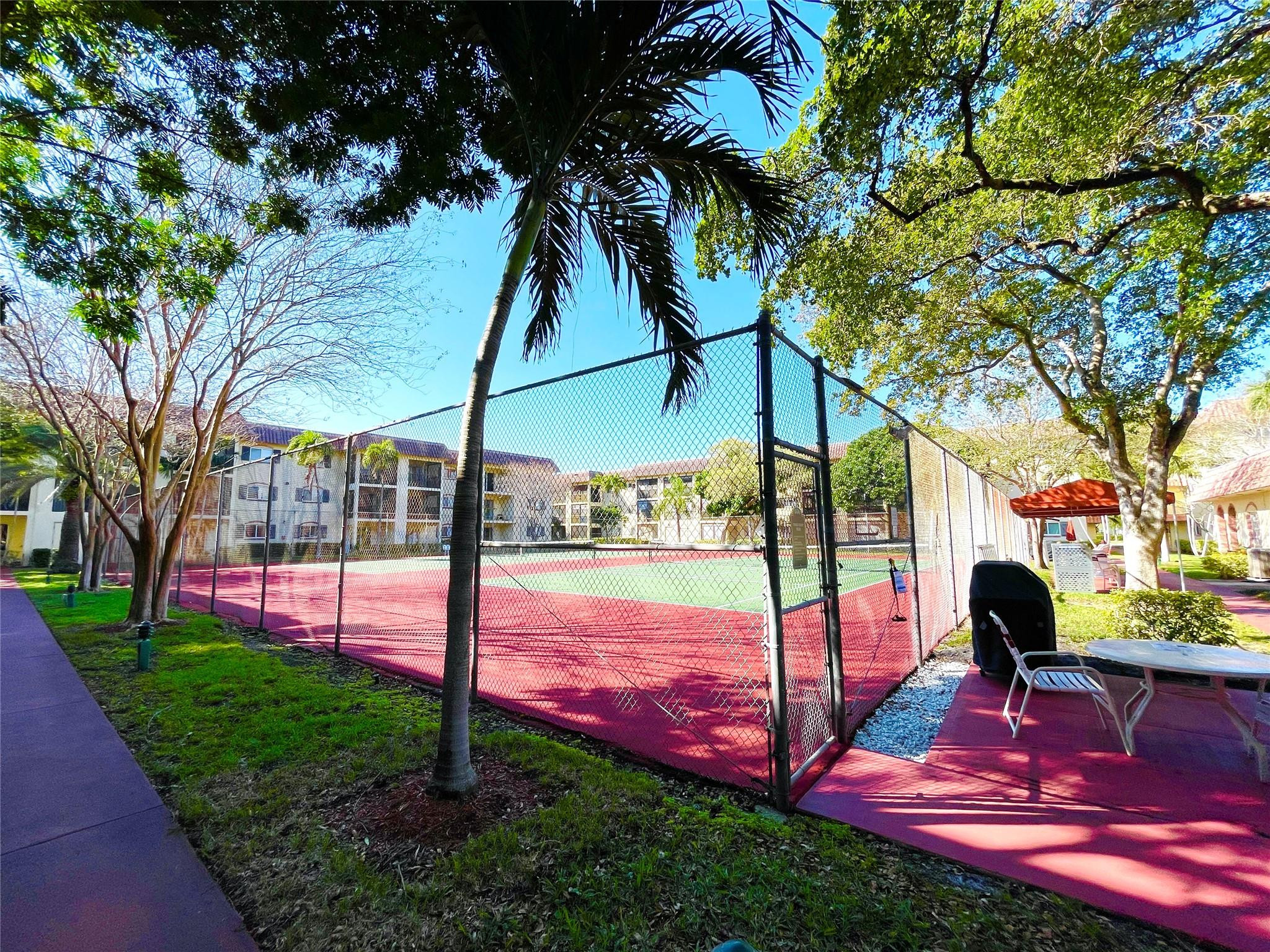 259 South Cypress Road, Unit 536 Pompano Beach, FL 33060 - Photo 39 of 39 a view of a park with plants and a yard