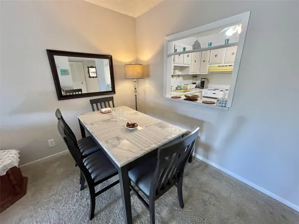 a view of a dining room with furniture