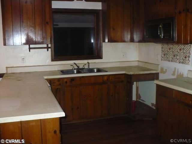 16680 Sandy Ford Road Chesterfield, VA 23838 - Photo 3 of 6 a kitchen with a sink and a microwave