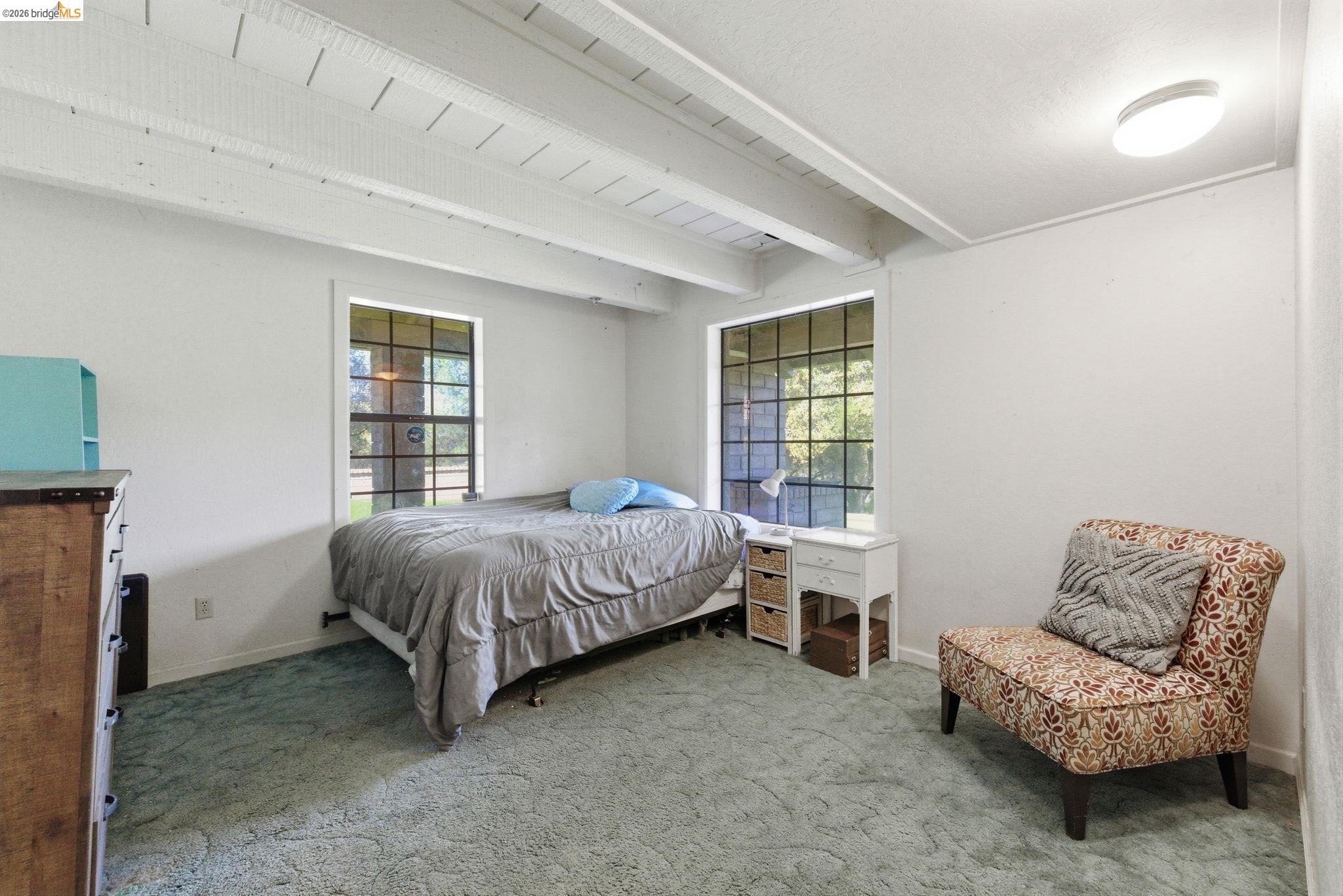 23608 Porcina Way Columbia, CA 95310 - Photo 14 of 51 a bedroom with a bed and a couch