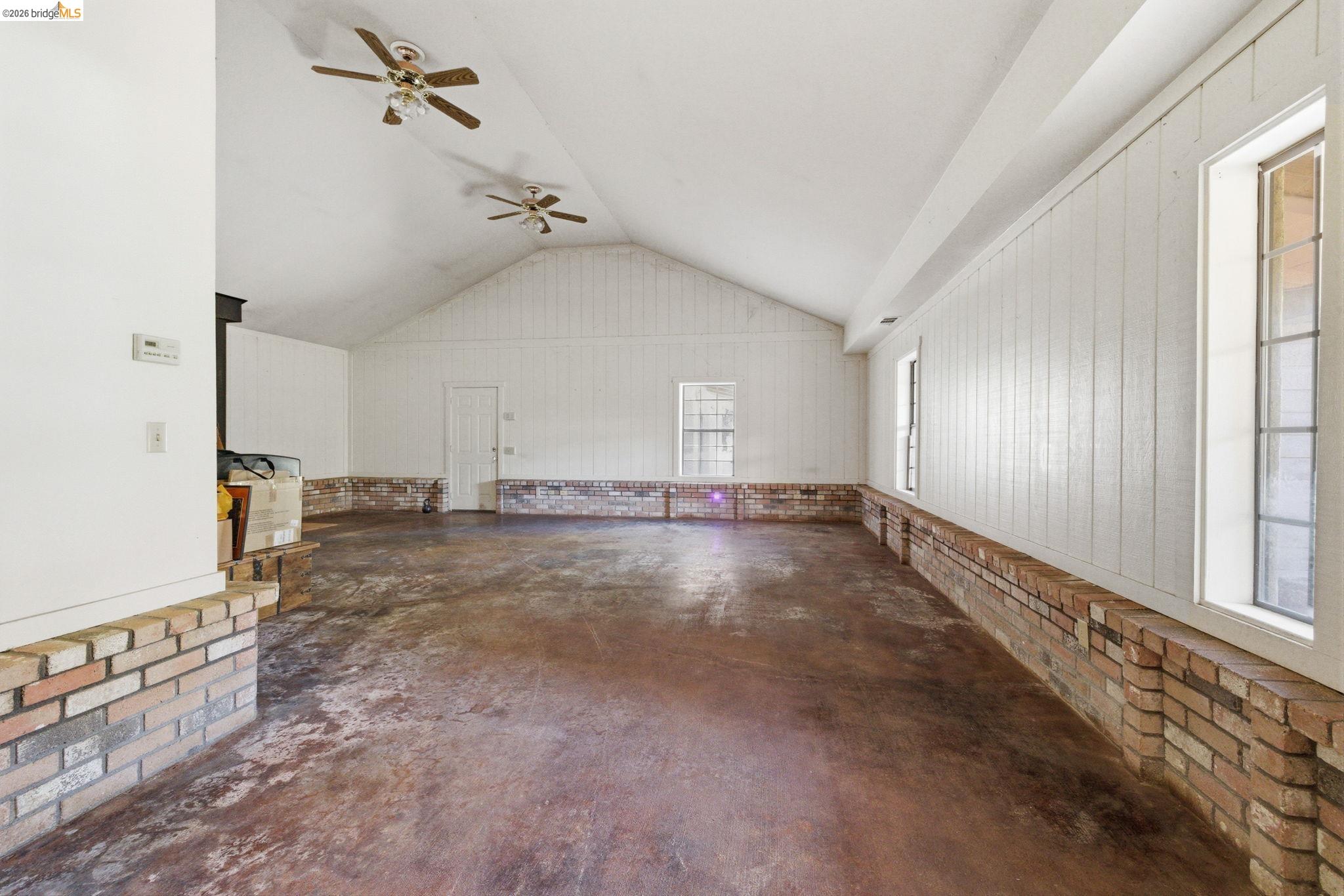 23608 Porcina Way Columbia, CA 95310 - Photo 21 of 51 a view of a livingroom with a ceiling fan and window