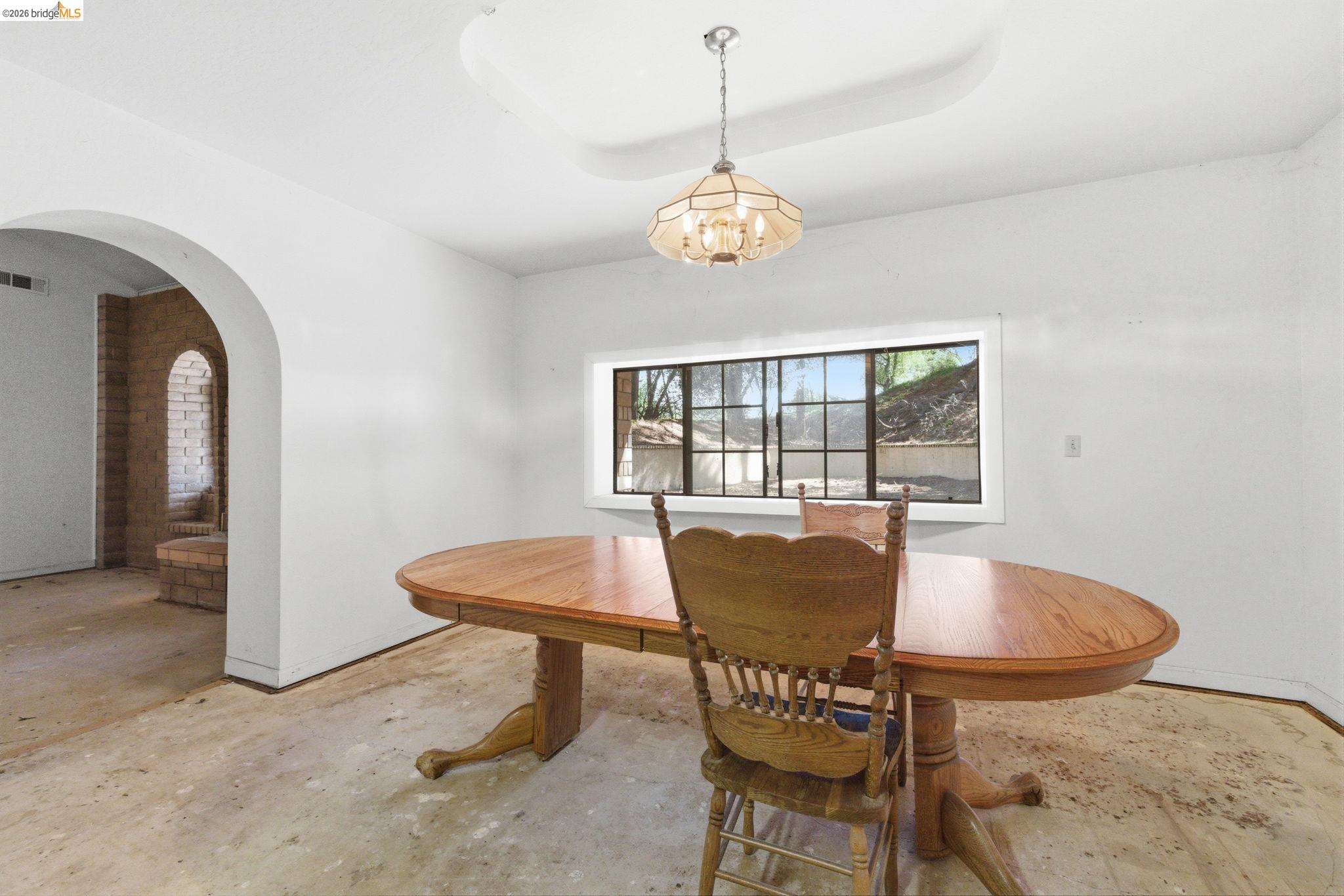 23608 Porcina Way Columbia, CA 95310 - Photo 41 of 51 a view of a dining room with furniture and a chandelier