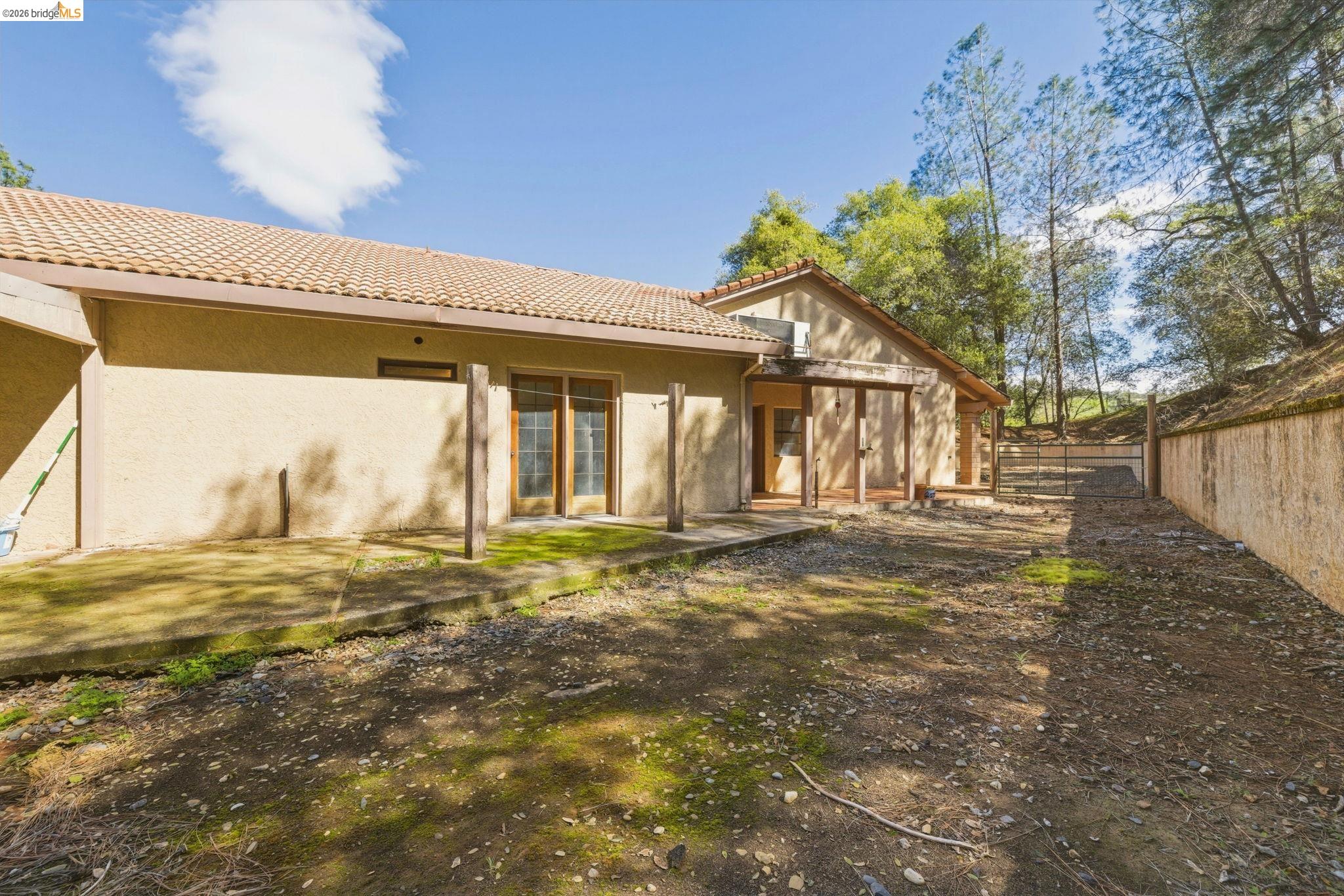 23608 Porcina Way Columbia, CA 95310 - Photo 51 of 51 a view of a house with a big yard and large tree