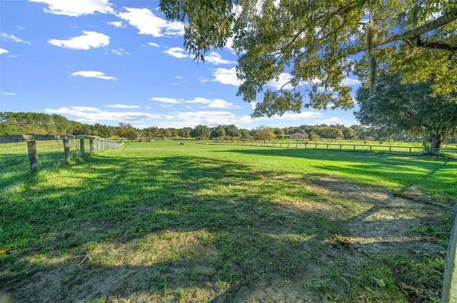 a view of a golf course with a lake