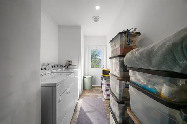 a bedroom with a bed and a chair