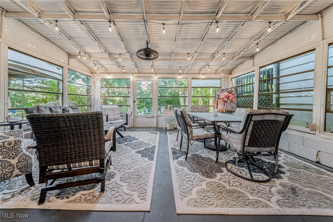 595 Moorfield Road Fairlawn, OH 44313 - Photo 34 of 50 Sunroom / solarium with plenty of natural light, concrete floors, and rail lighting